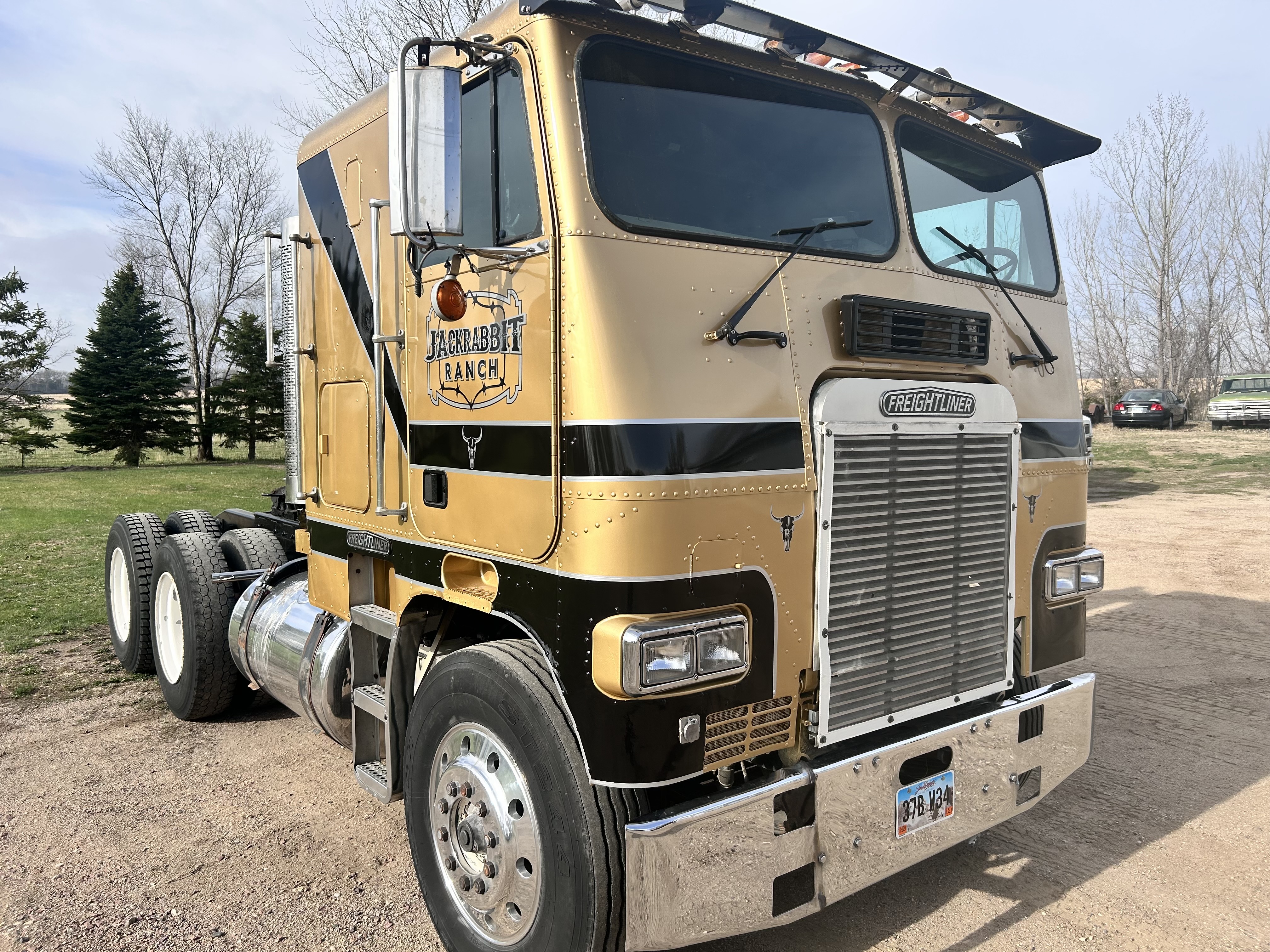 Custom vehicle graphics on a gold semi truck